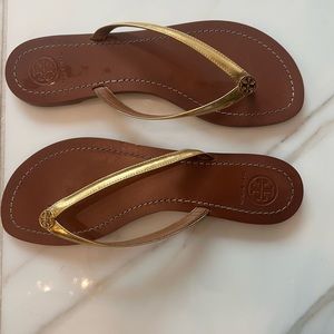 Tory Burch gold flip flops.  Hardly worn